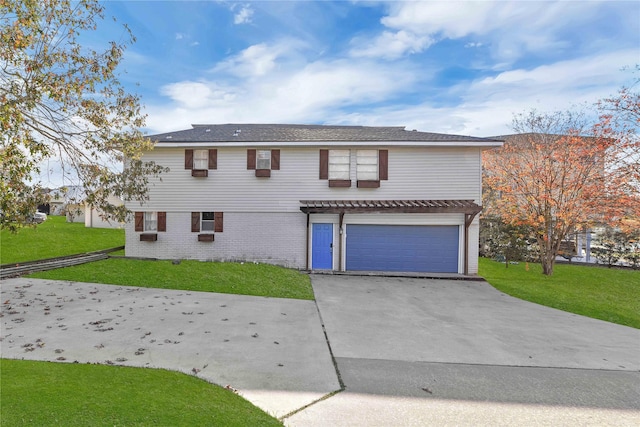 view of front of house featuring a garage and a front yard