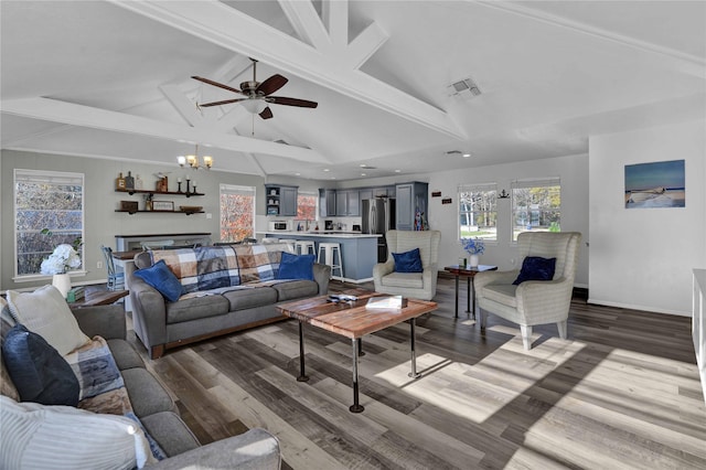 living room with lofted ceiling with beams, wood-type flooring, and ceiling fan with notable chandelier