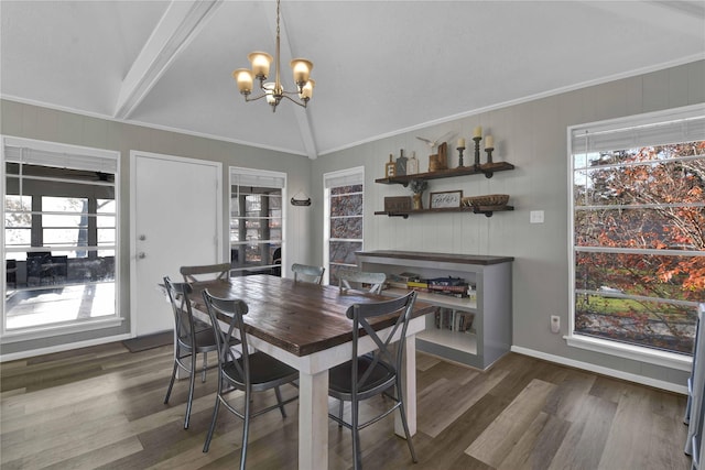 dining area with lofted ceiling with beams, dark hardwood / wood-style floors, plenty of natural light, and a chandelier