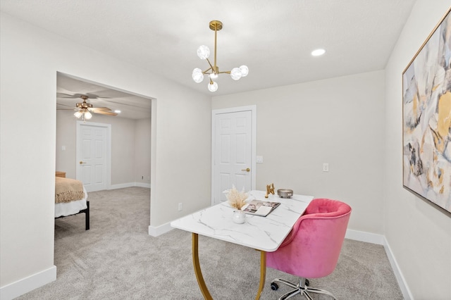 carpeted office with ceiling fan with notable chandelier