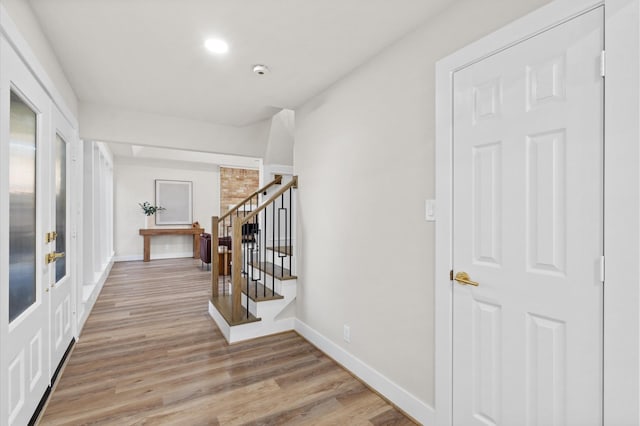 hall with light wood-type flooring