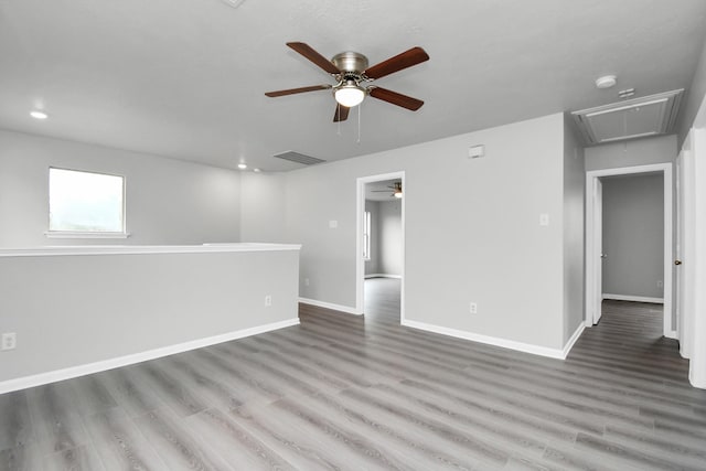 unfurnished room featuring ceiling fan and hardwood / wood-style flooring