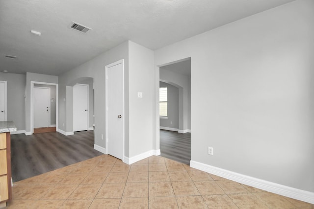 spare room featuring light hardwood / wood-style flooring