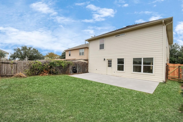 rear view of property with a patio area and a lawn