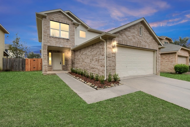 view of front of home with a lawn and a garage