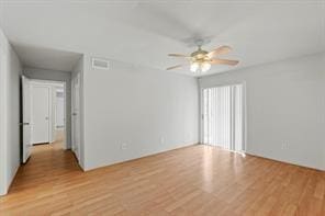 unfurnished room with ceiling fan and light hardwood / wood-style flooring