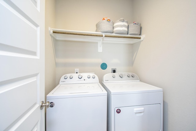 laundry room with separate washer and dryer