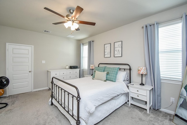 bedroom featuring light colored carpet and ceiling fan