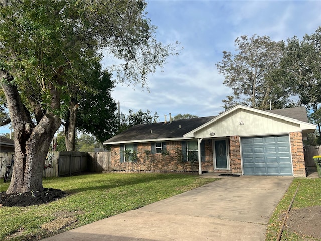 single story home with a front yard and a garage