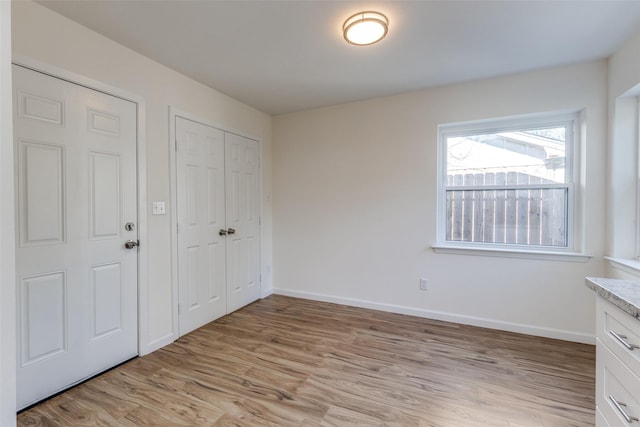 unfurnished bedroom featuring light hardwood / wood-style flooring