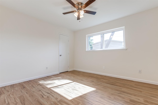 spare room with ceiling fan and light hardwood / wood-style flooring