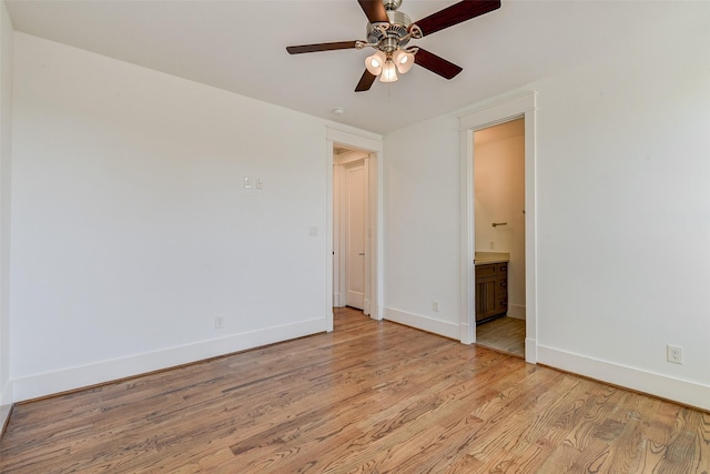 spare room featuring ceiling fan and light wood-type flooring