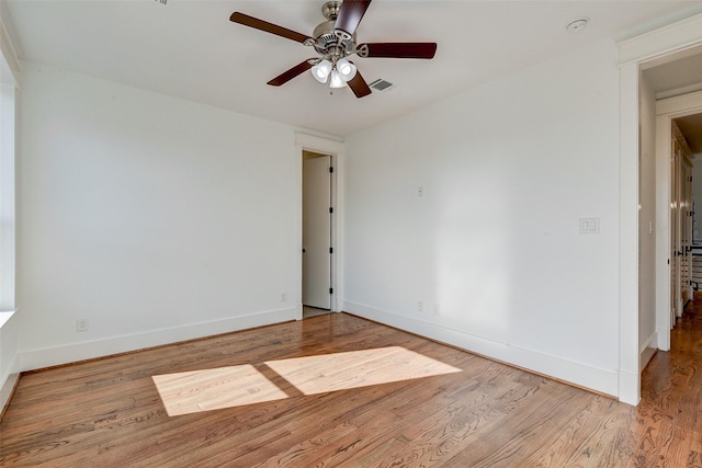 spare room with ceiling fan and light hardwood / wood-style flooring