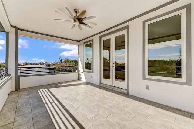 interior space with a wealth of natural light and ceiling fan