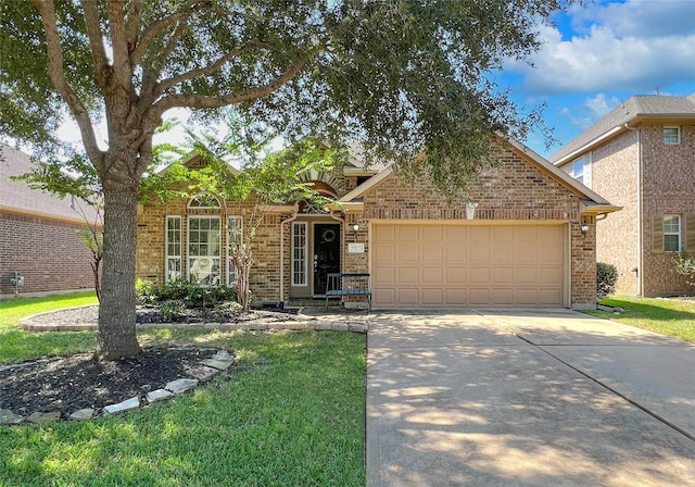 view of front of house featuring a garage and a front yard