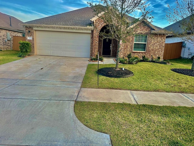 ranch-style house featuring a front yard and a garage