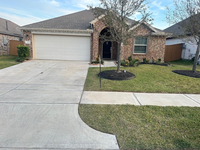 ranch-style house with a front yard and a garage