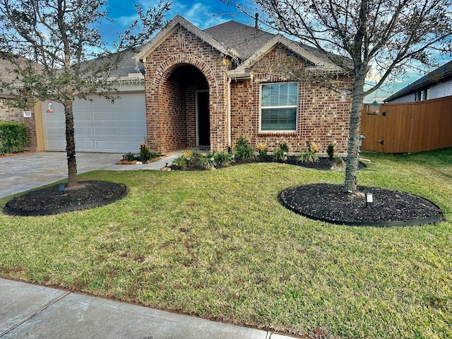 view of front of property with a garage and a front lawn