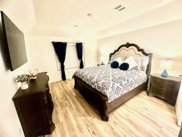 bedroom with light hardwood / wood-style flooring