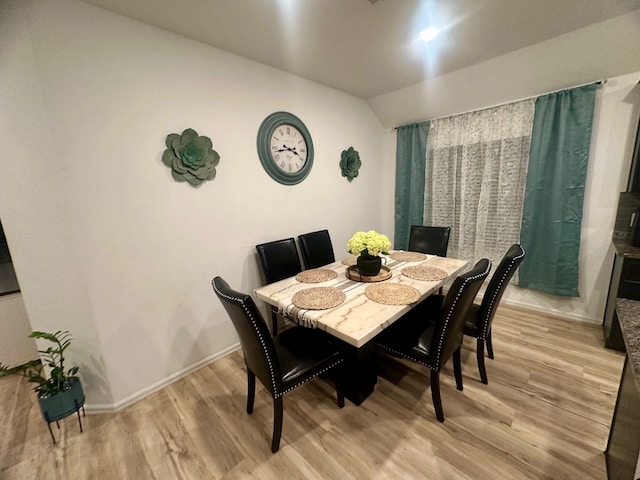 dining space featuring light hardwood / wood-style flooring