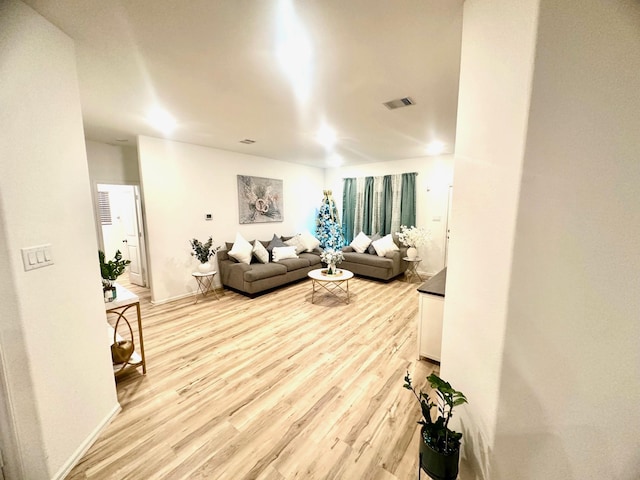 living room with light hardwood / wood-style flooring