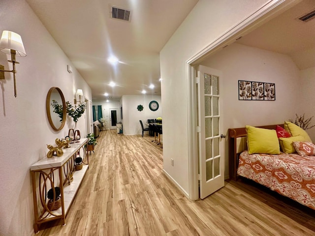 hallway featuring light hardwood / wood-style flooring