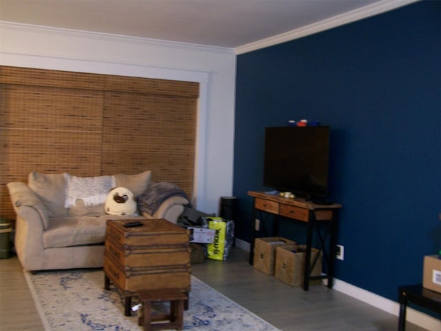 living room with wood-type flooring and crown molding