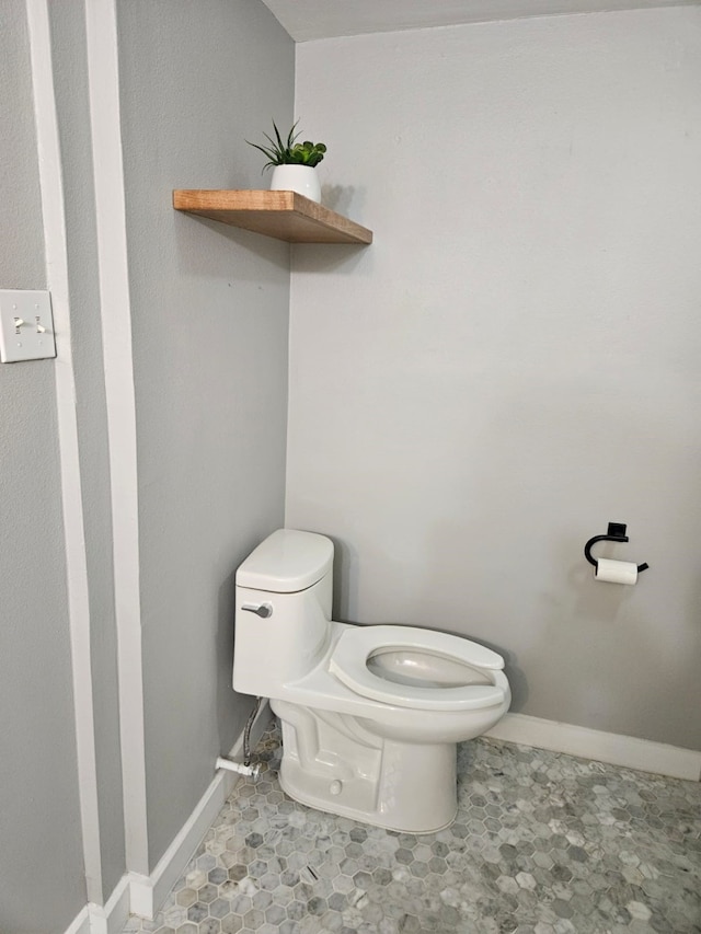 bathroom featuring toilet