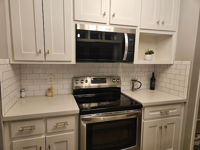 kitchen with white cabinetry, stainless steel electric stove, tasteful backsplash, and light stone counters