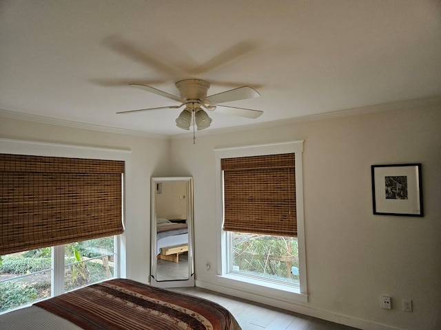 unfurnished bedroom featuring crown molding, ceiling fan, and light hardwood / wood-style floors