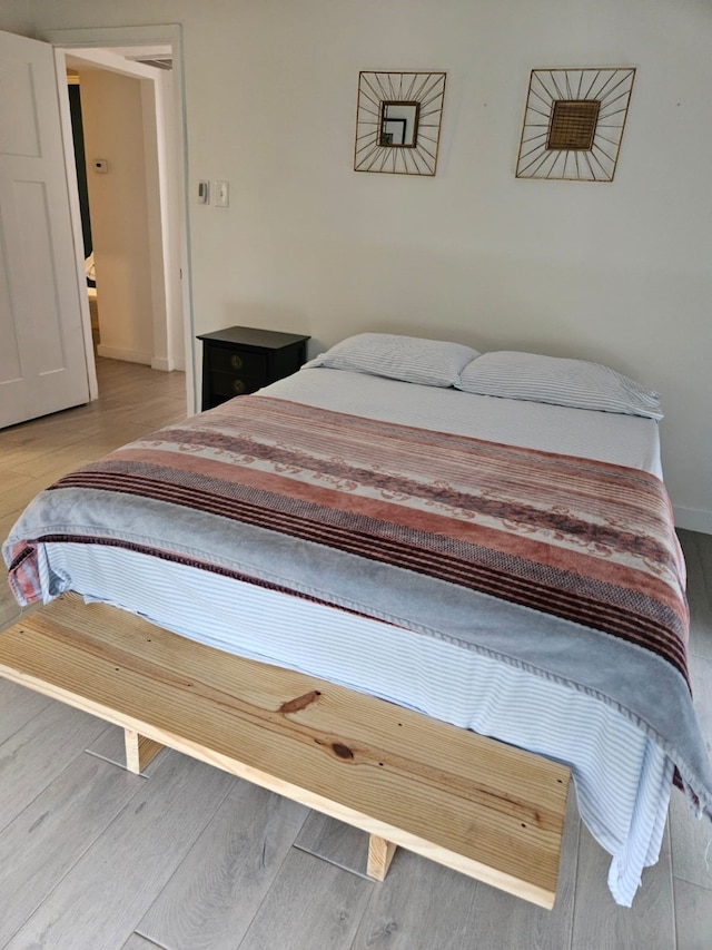 bedroom featuring hardwood / wood-style flooring