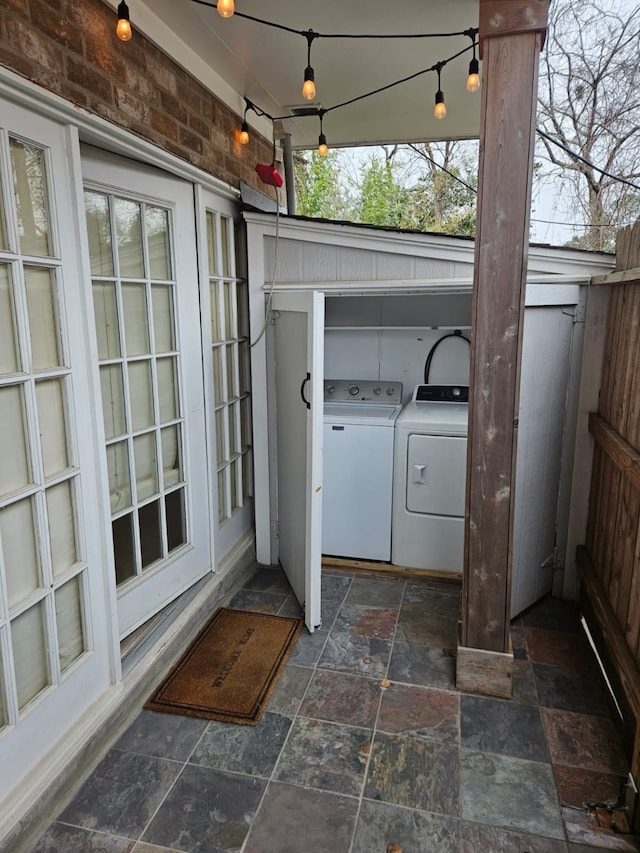 clothes washing area featuring washer and dryer