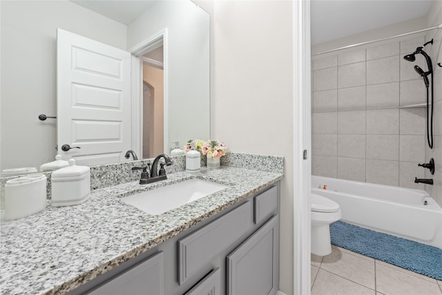 full bathroom with tile patterned floors, vanity, toilet, and tiled shower / bath