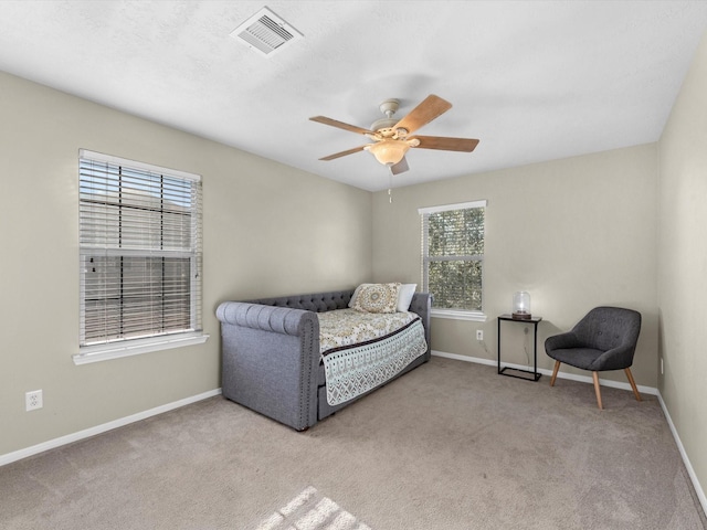 carpeted bedroom featuring ceiling fan