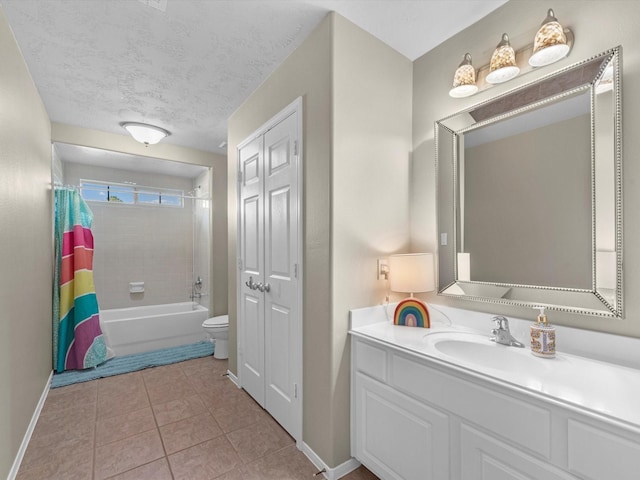 full bathroom with vanity, tile patterned floors, toilet, shower / bathtub combination with curtain, and a textured ceiling