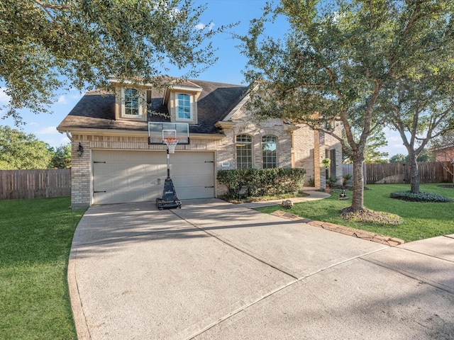 view of front facade featuring a garage and a front lawn