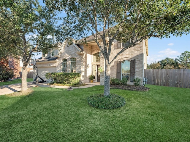 view of front facade featuring a garage and a front lawn