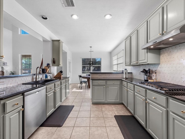 kitchen featuring gray cabinets, a wealth of natural light, sink, and stainless steel appliances