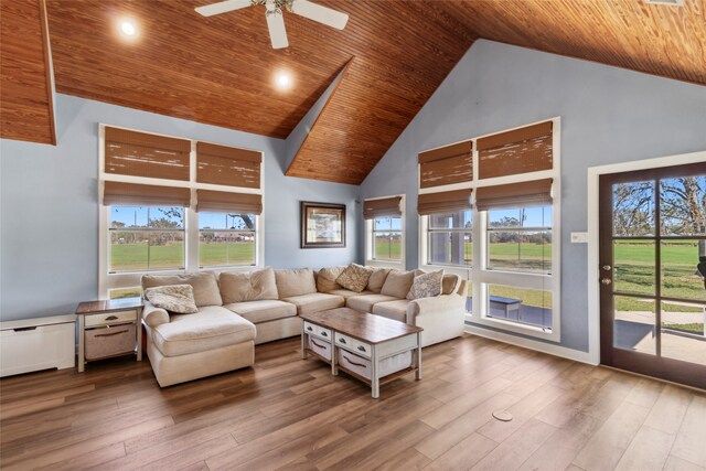 living room with hardwood / wood-style floors, high vaulted ceiling, plenty of natural light, and wood ceiling