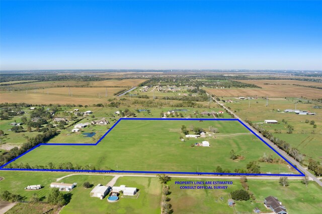 birds eye view of property featuring a rural view