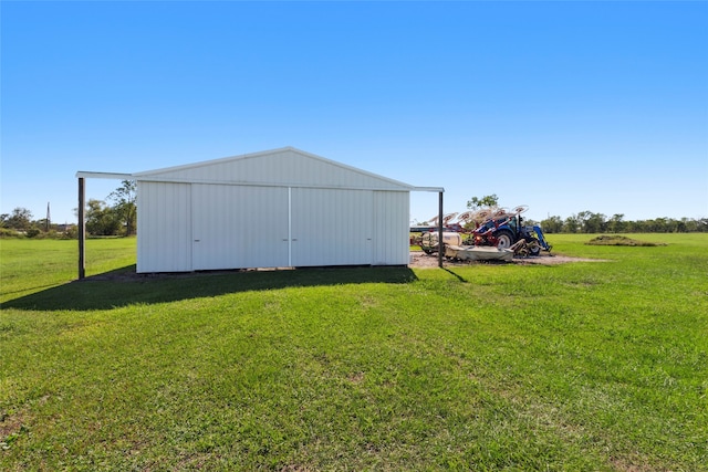 view of outdoor structure featuring a lawn