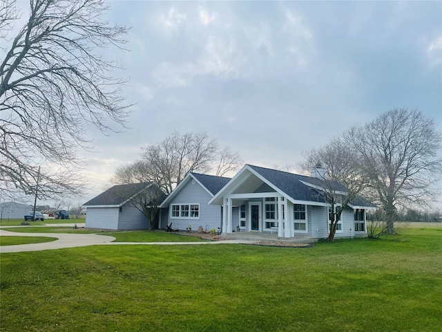 single story home featuring a front lawn