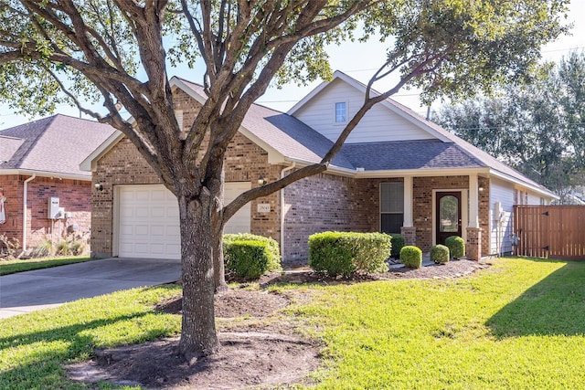 view of front of house featuring a front yard and a garage