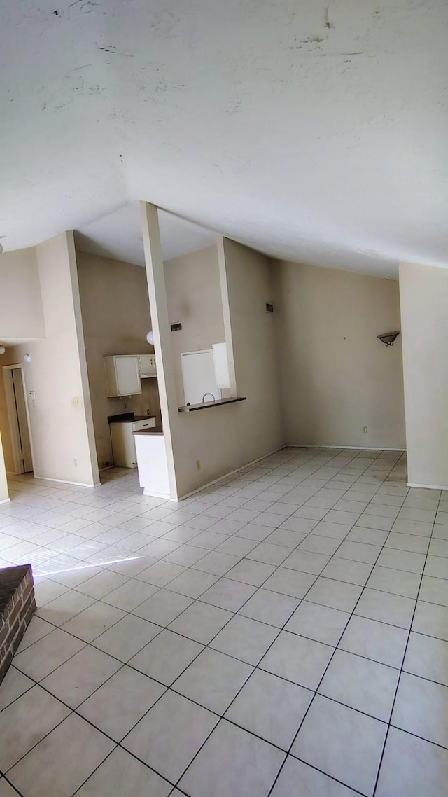 unfurnished living room with light tile patterned floors