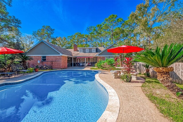 view of swimming pool featuring a patio area