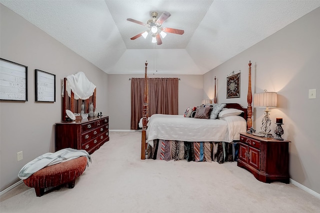 bedroom with a textured ceiling, light colored carpet, ceiling fan, and lofted ceiling