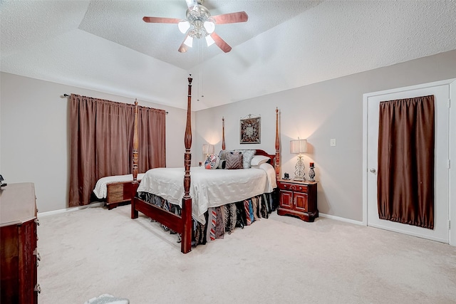 carpeted bedroom with ceiling fan, lofted ceiling, and a textured ceiling