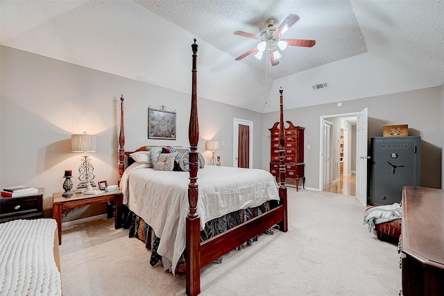 bedroom with carpet flooring, ceiling fan, and a textured ceiling