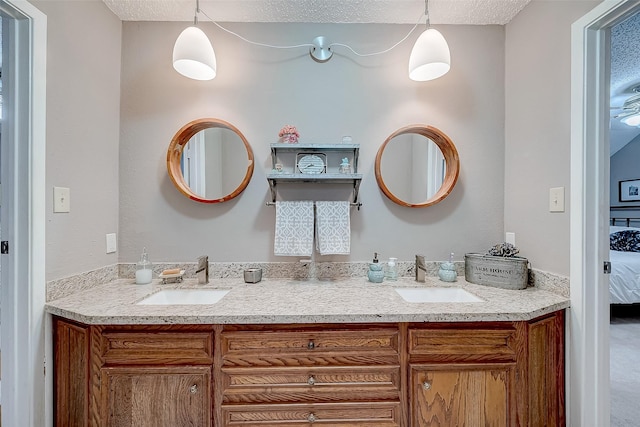 bathroom featuring vanity and a textured ceiling