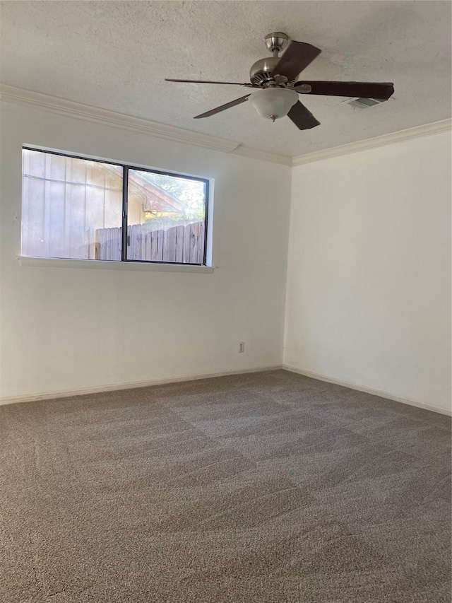 carpeted empty room with a textured ceiling, ceiling fan, and ornamental molding